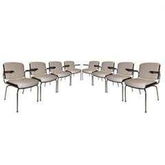 A Set of Eight Modernist Dining Chairs in Chromed Steel, Rosewood and Upholstery