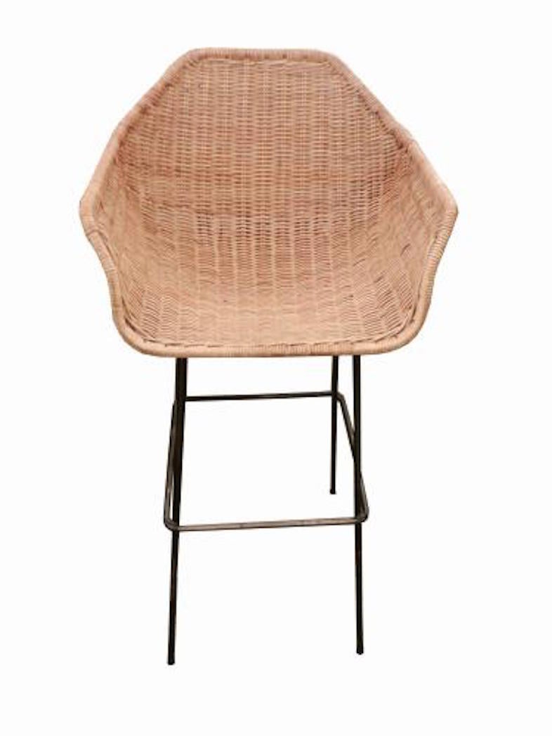 Set of six Mid-Century bar stools each featuring frames in blackened tubular steel with floating one piece shaped seat, back and armrests in wicker. Attributed to Charles Ramos, France, circa 1960. These bar stools are a great example of Mid-Century