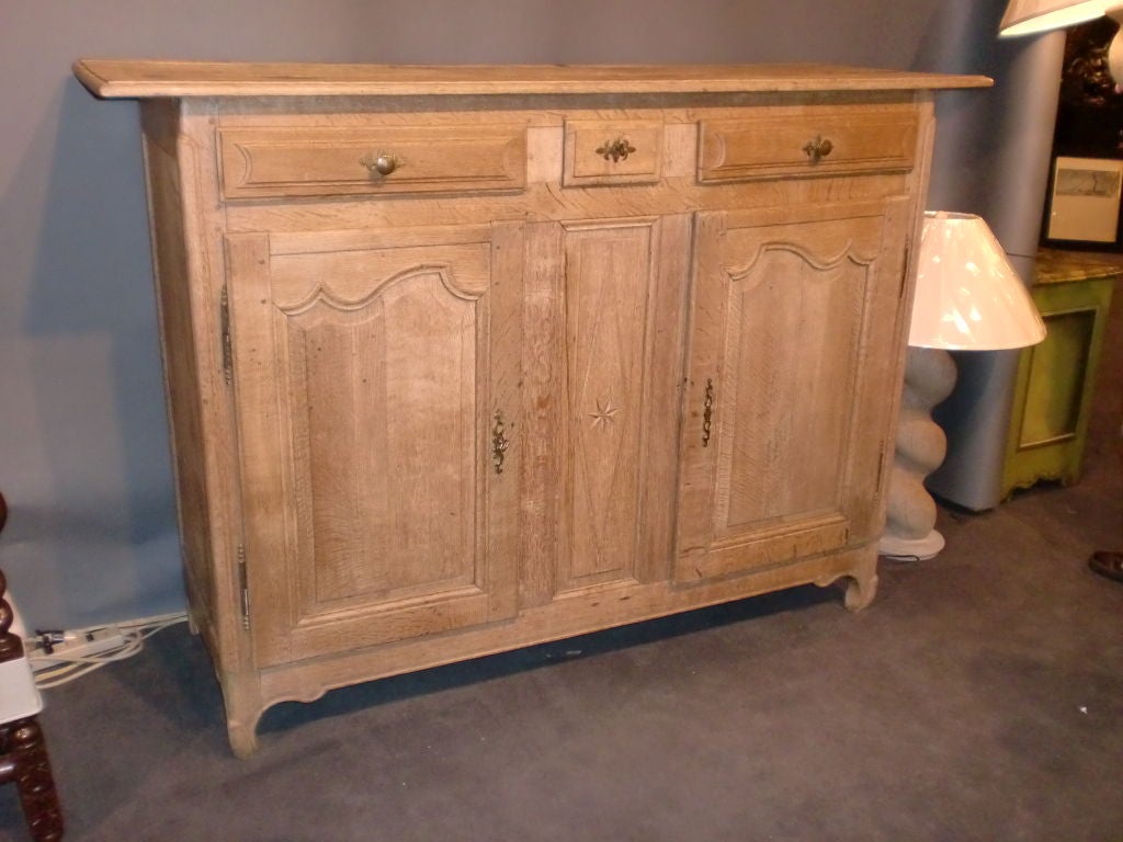 Bleached Oak Sideboard with 3 top Drawers above 2 cupboard doors with interior shelf.Has lock on both doors.