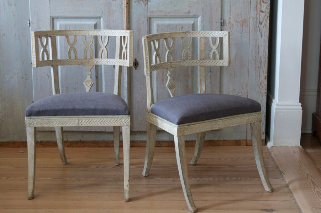 Very elegant pair of Klismos side chairs in the manner of Ephriam Stahl.