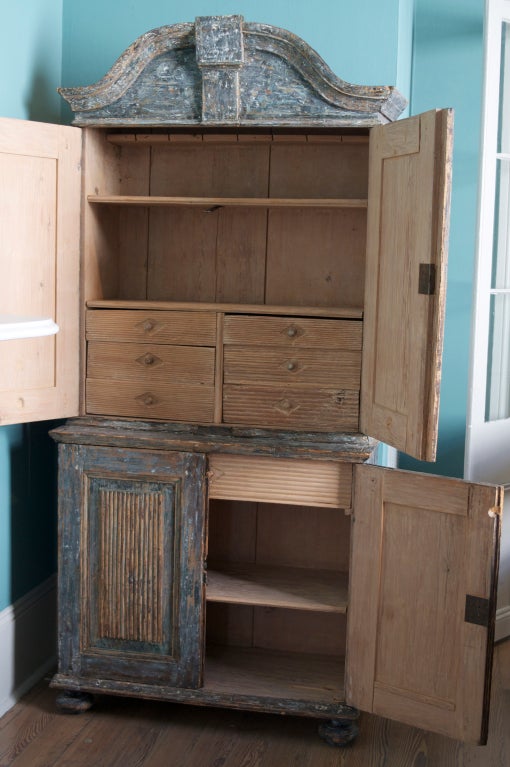 Very charming, small Swedish cabinet with interior shelves and drawers; later paint removed to reveal original blue-black paint.