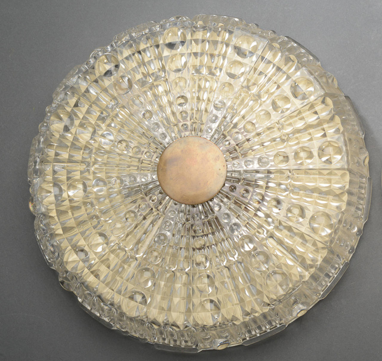 1950s-early 1960s brass-mounted pressed glass flush mount ceiling fixture designed by Carl Fagerlund for Orrefors of Sweden. Note: pair available.