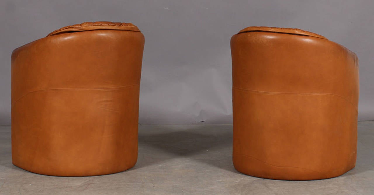 Pair of Small Danish 1960s Tub Chairs Upholstered in Cognac Colored Leather.