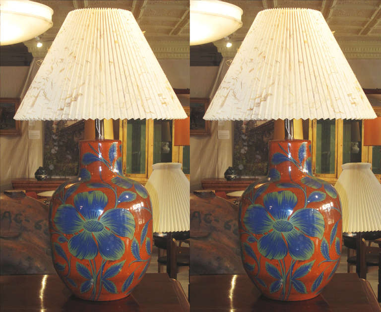 Pair of Mid-Century Ceramic Table Lamps.  Blue and Green Flowers and Leaves on a Orange Background.  Note:  Height dimension is to top of ceramic.