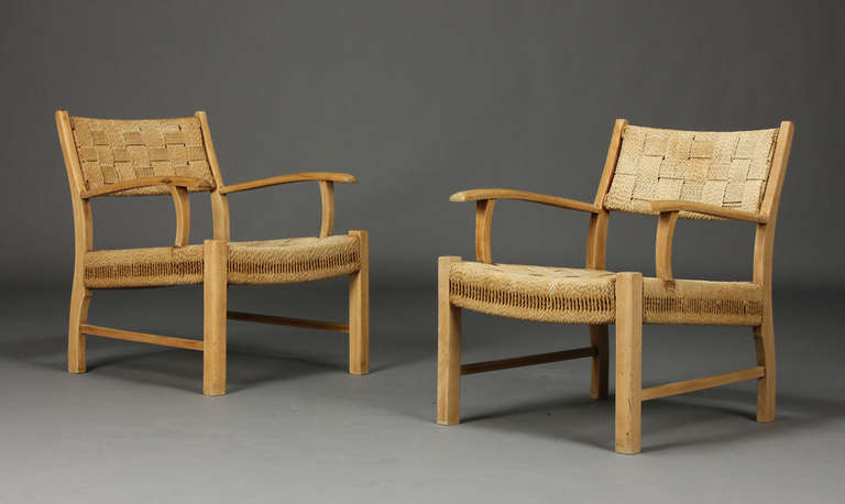 Pair of Danish beech and paper cord weave armchairs.  Circa 1950s, in the manner of Fritz Schlegel.