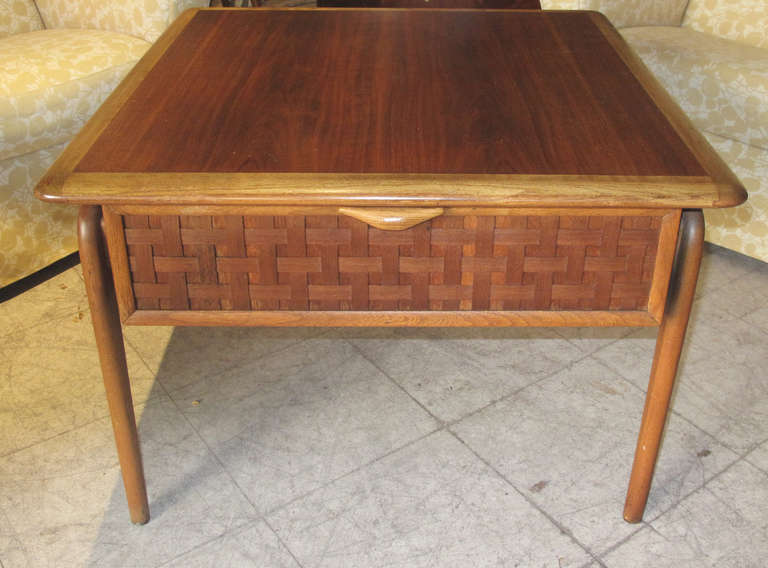 Early 1960s mahogany low table with basket weave front and single pull-out drawer.