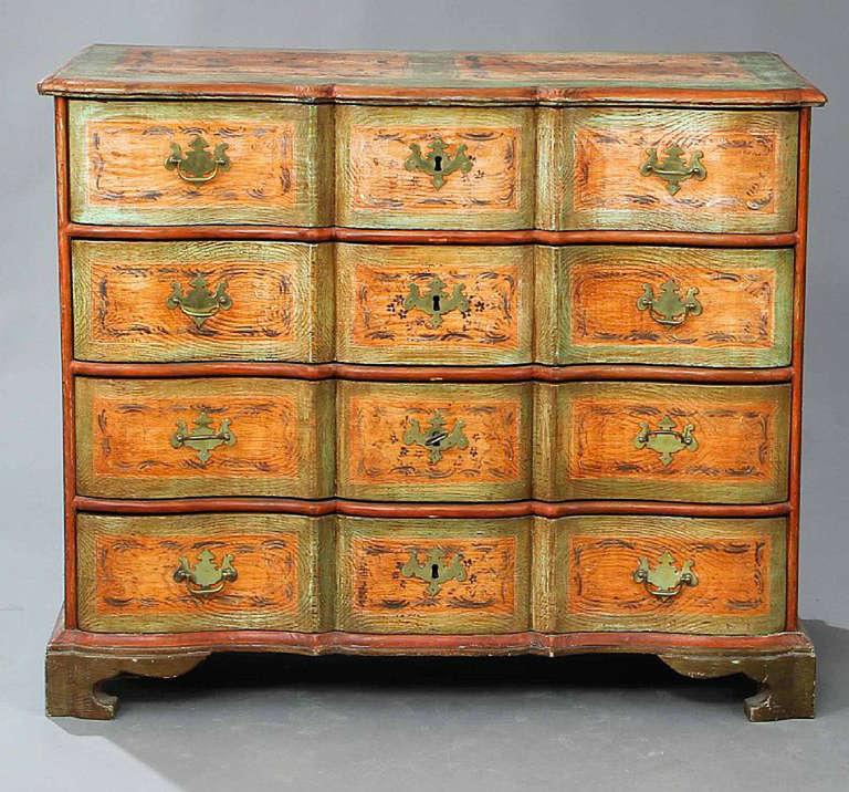 The chest late 18th century, the chest painted later in the 19th century. The drawers tops and sides with painted floral decoration.