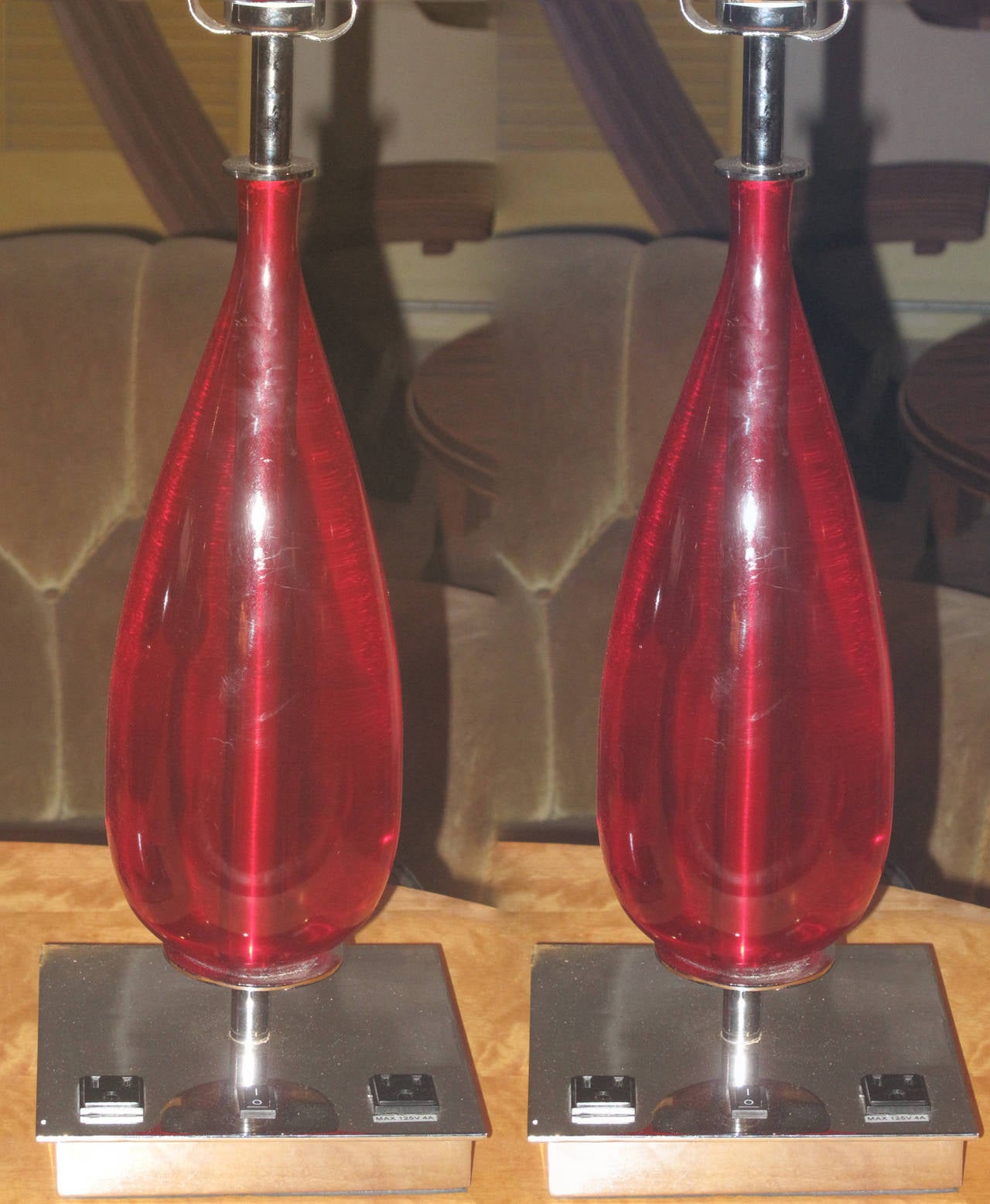 Pair of 1970s-1980s chrome and red acrylic teardrop form table lamps. Height is 20" from base to top of socket, base is 7" squared.