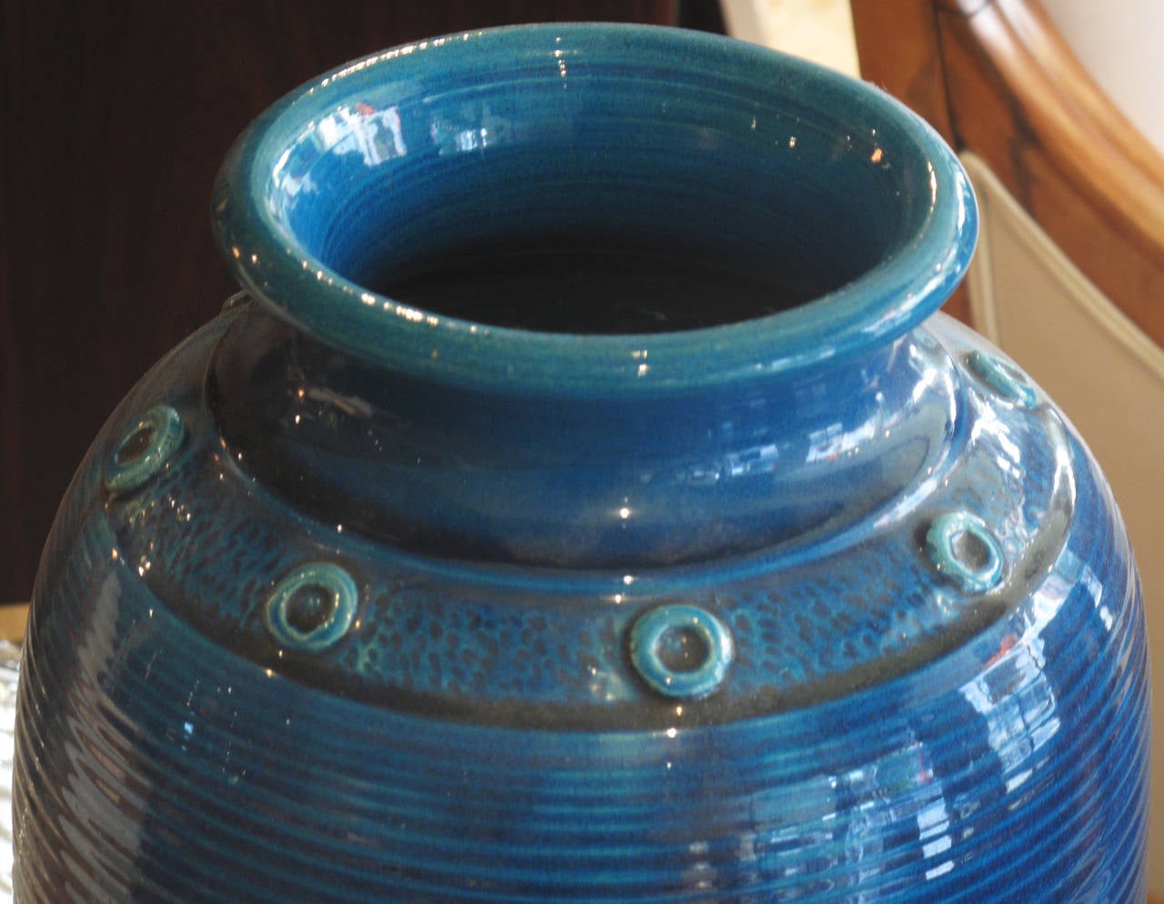 Large blue glazed (I would say close to a cobalt blue) ceramic vase. The body with ribbed and applied decoration. By the Kähler ceramic factory which was located in Naestved, Denmark. The vase, circa 1940s.
