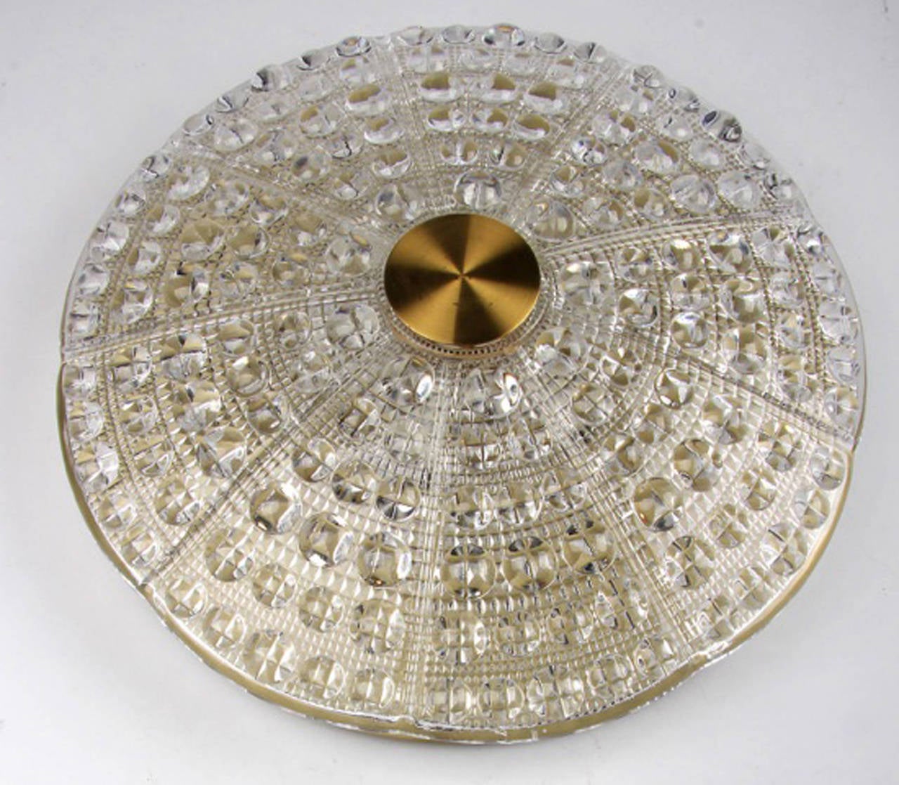 Brass-mounted pressed glass fixture suspended from a ceiling mounted brass disk. Designed by Carl Fagerlund for Orrefors of Sweden, circa 1950s. Note: We have several of this type model.
