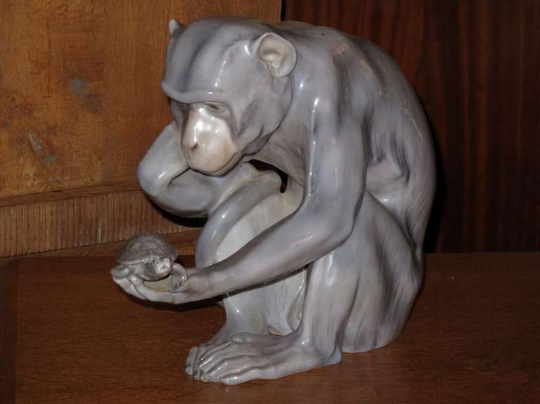 Glazed Ceramic of a Monkey Holding and Contemplating a Tortoise;  Circa 1905.   The figure by Dahl Jensen for B & G  of Denmark.