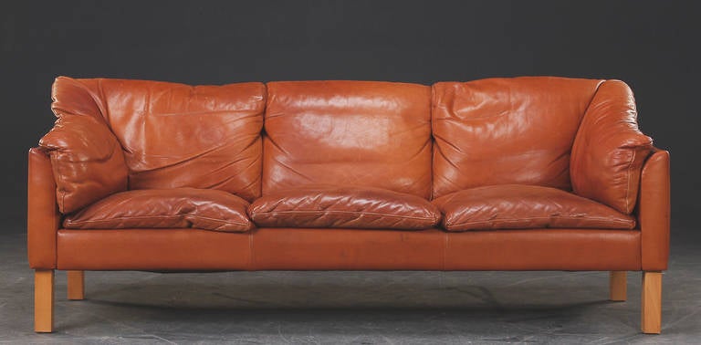 Three Seat Sofa Upholstered in Tobacco Colored Leather;  Circa 1960s.
