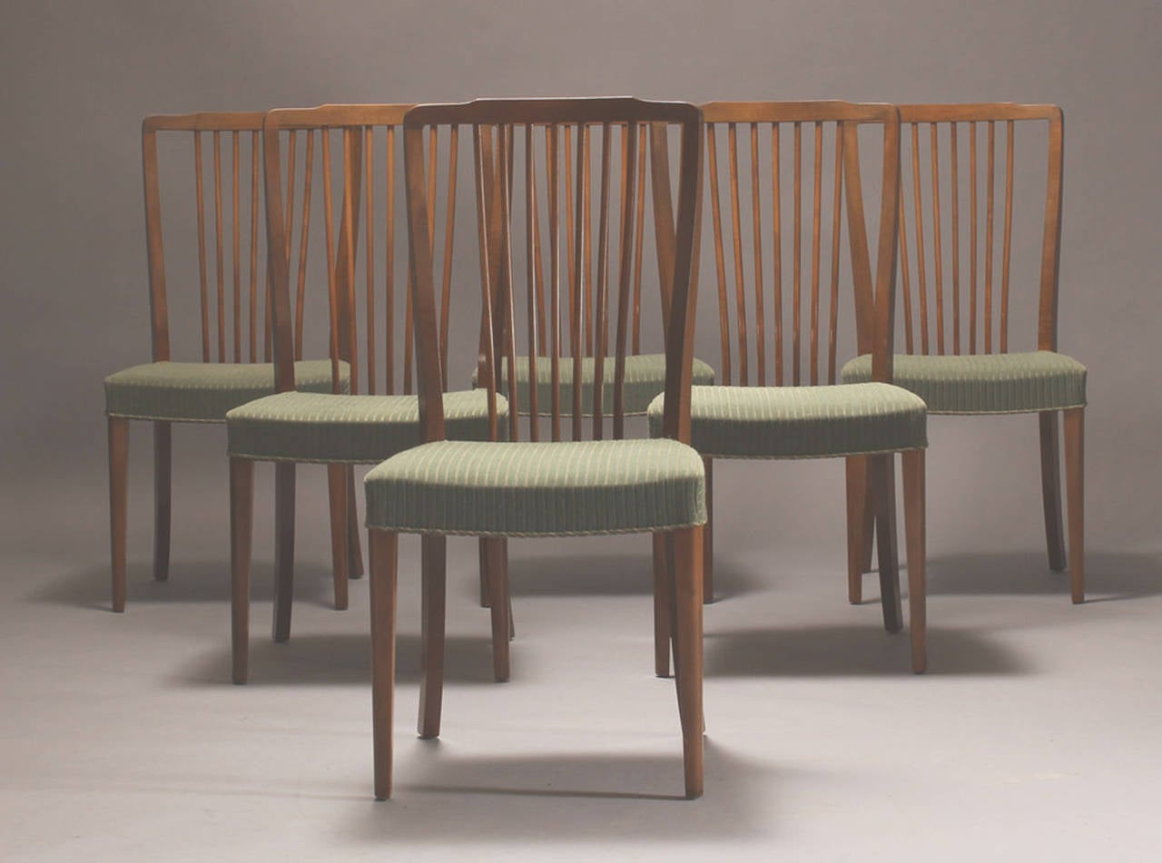 Set of Six Danish High Spindle Back Dining Chairs of Stained Beech, Circa 1940s.