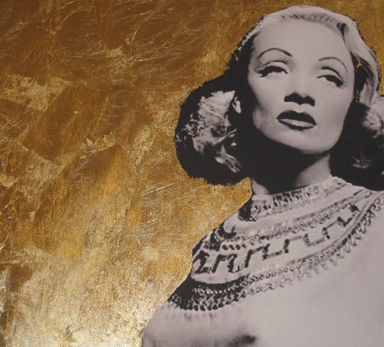 Mixed-media artwork of Marlene Dietrich. The background gold-leafed, the image of Dietrich is a photo shopped image supplemented with paint. Signed lower left hand Frederico de Albinini.