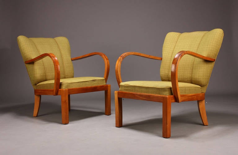 Pair of Danish Modern 1930s-40s Armchairs with Exaggerated Curved Arms; the frames of Elm Wood.  Note:  Chairs need to be reupholstered.