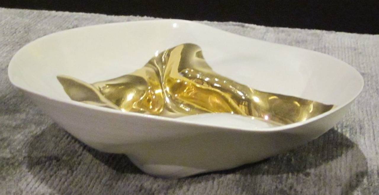 Handmade gold leaf accented bowl.
Free-form organic shape.
Fine ceramic base.
