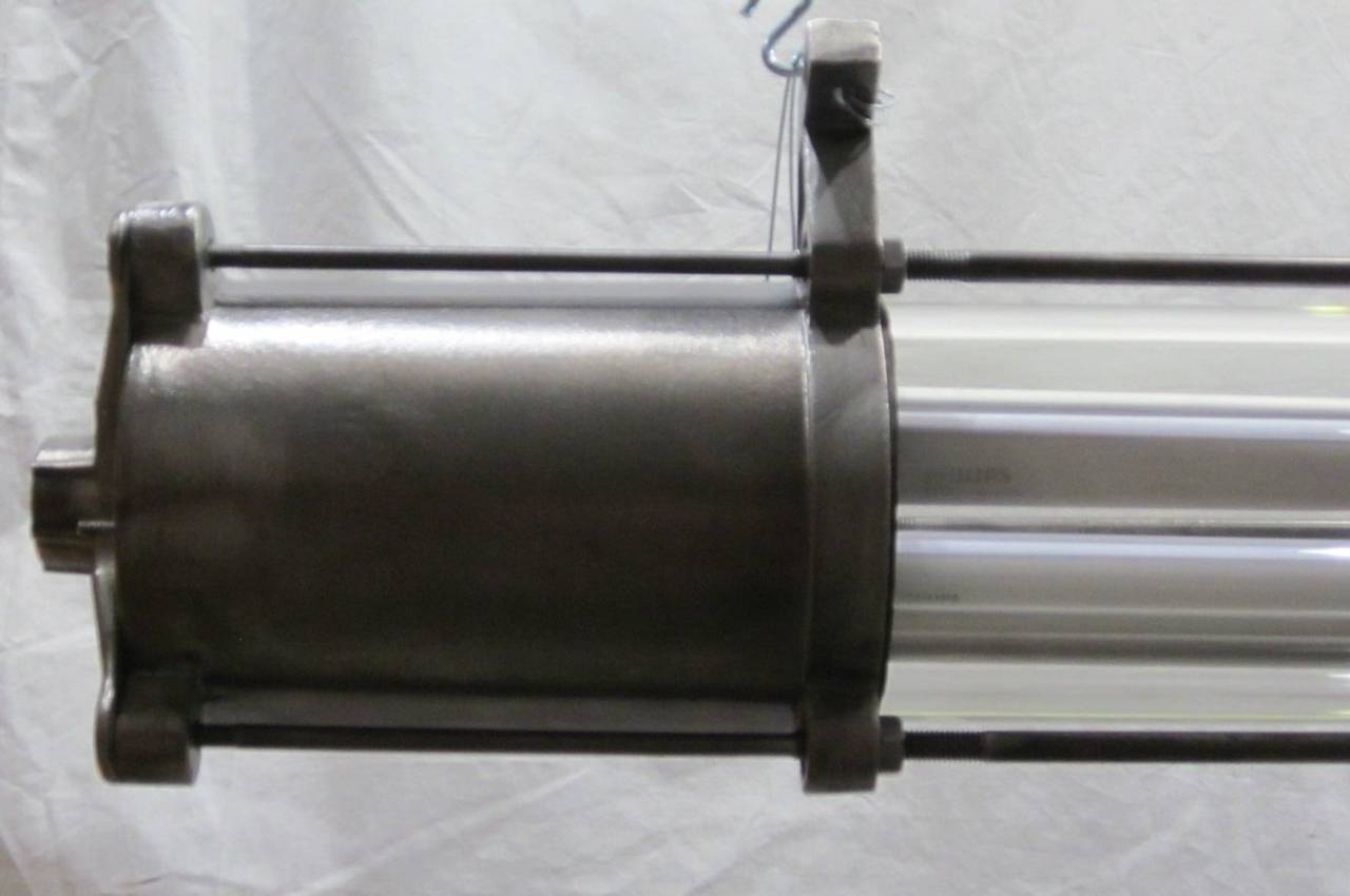 Unique brushed steel industrial tube lights which originated in Eastern European factories. Both are in excellent condition and have been completely refurbished and wired for use in the United States.  The fixtures have been fitted with Phillips LED