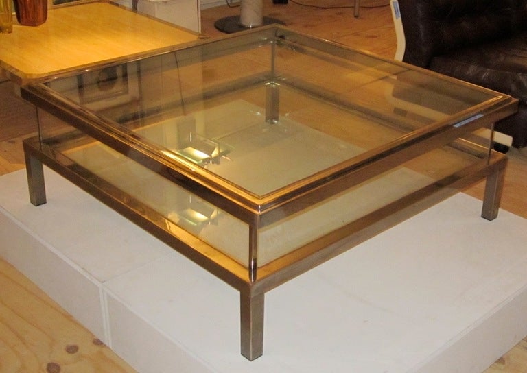 1960's Maison Jansen chrome and glass vitrine coffee table.  Top slides halfway open allowing display of decorative items.