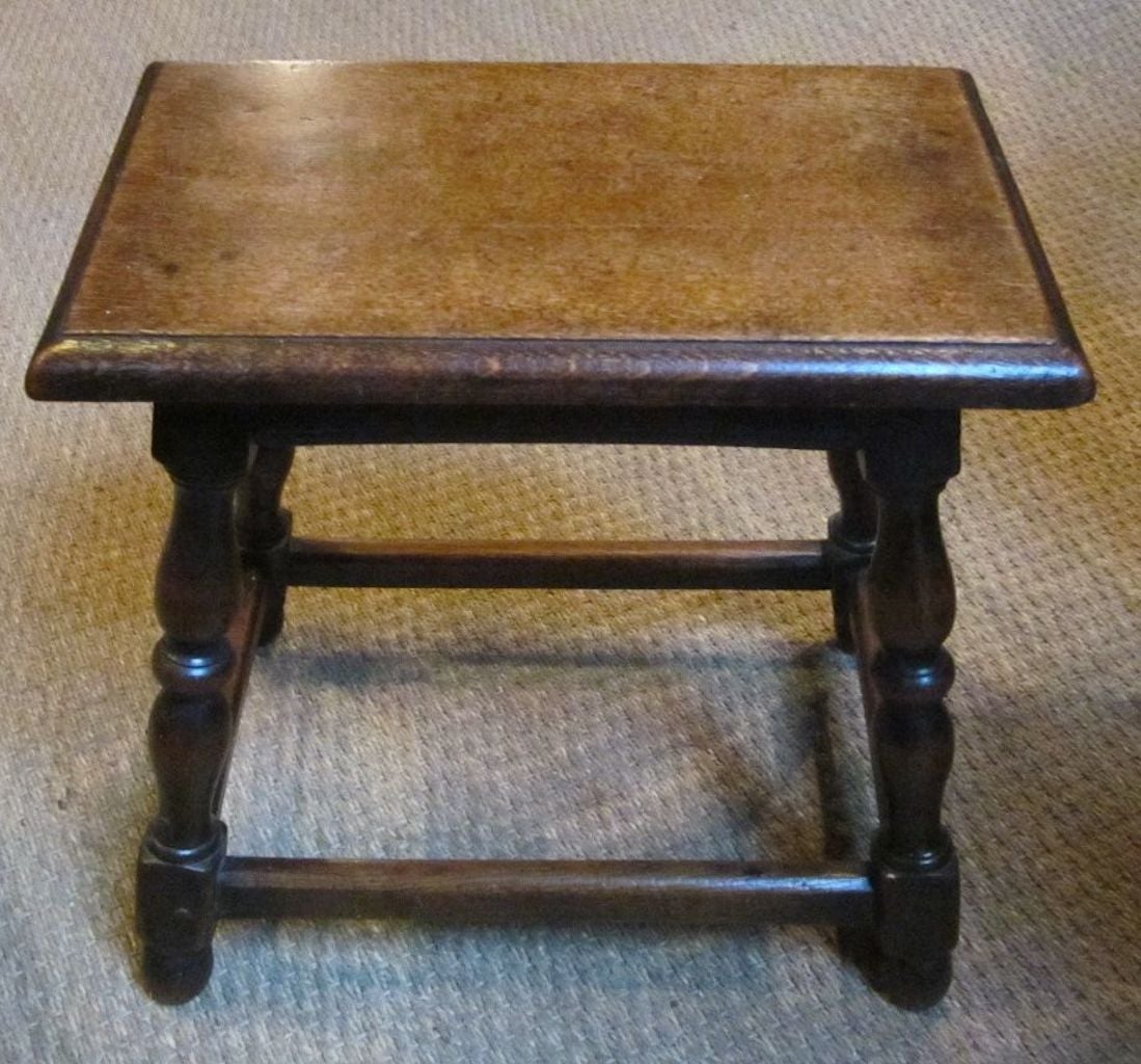 19th century classic English oak joint stool makes a great side table. 
Joint stools originated in middle England and are low stools having turned wood legs with all parts joined by a mortise.
Nice worn patina.
A pair is available. Sold