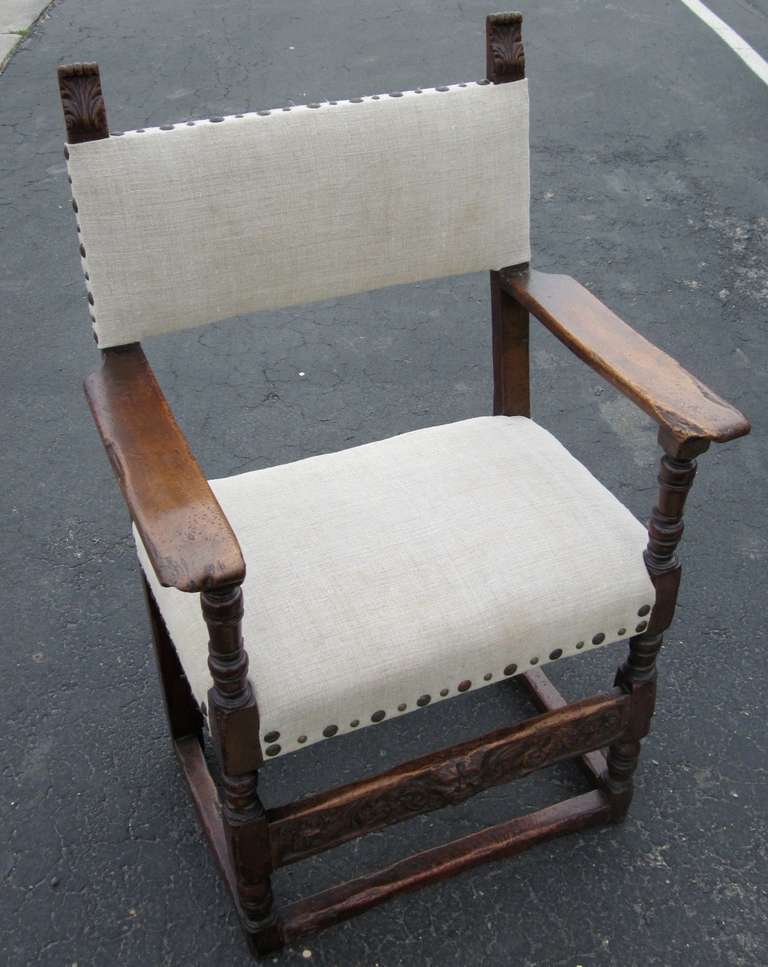 18th century Italian walnut side chair.  The seat and back have been recently reupholstered in vintage Belgian linen using decorative large and small nailhead accents.
The front legs are turned leg, back legs are smooth with a decoratively carved