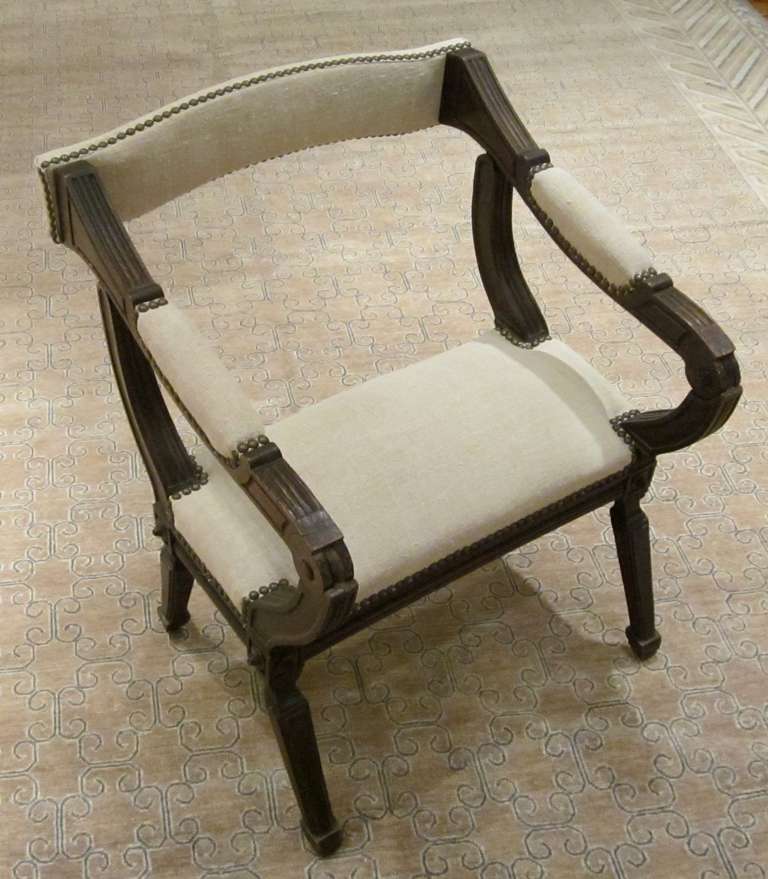Convertible back prayer chair.  The chair goes from a sitting position to a kneeling position. Decorative nailhead accents throughout the upholstery.
Recently reupholstered in vintage Belgian linen.