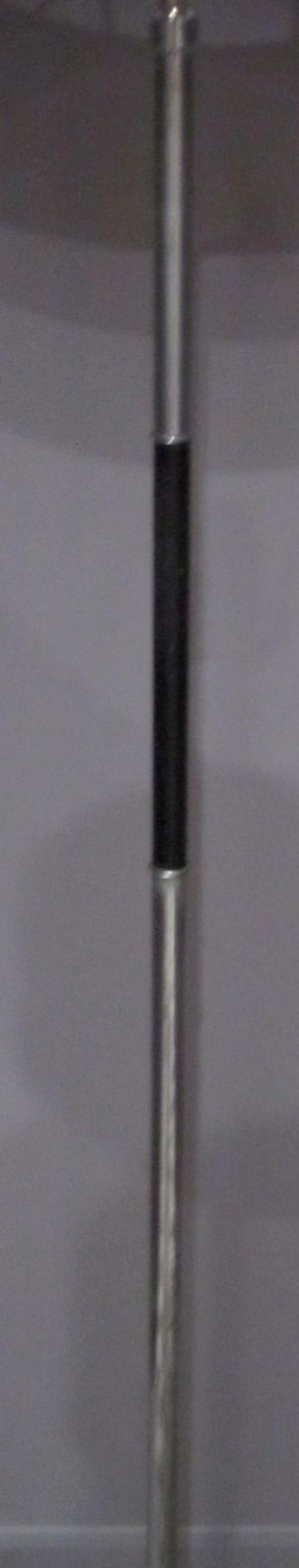 Mid-Century French pole lamp with tripod legs. The pole is chrome with a band of black metal towards the top of the pole. The legs are black metal with small chrome cylinders at the end of each leg.
The shade is natural linen.
61