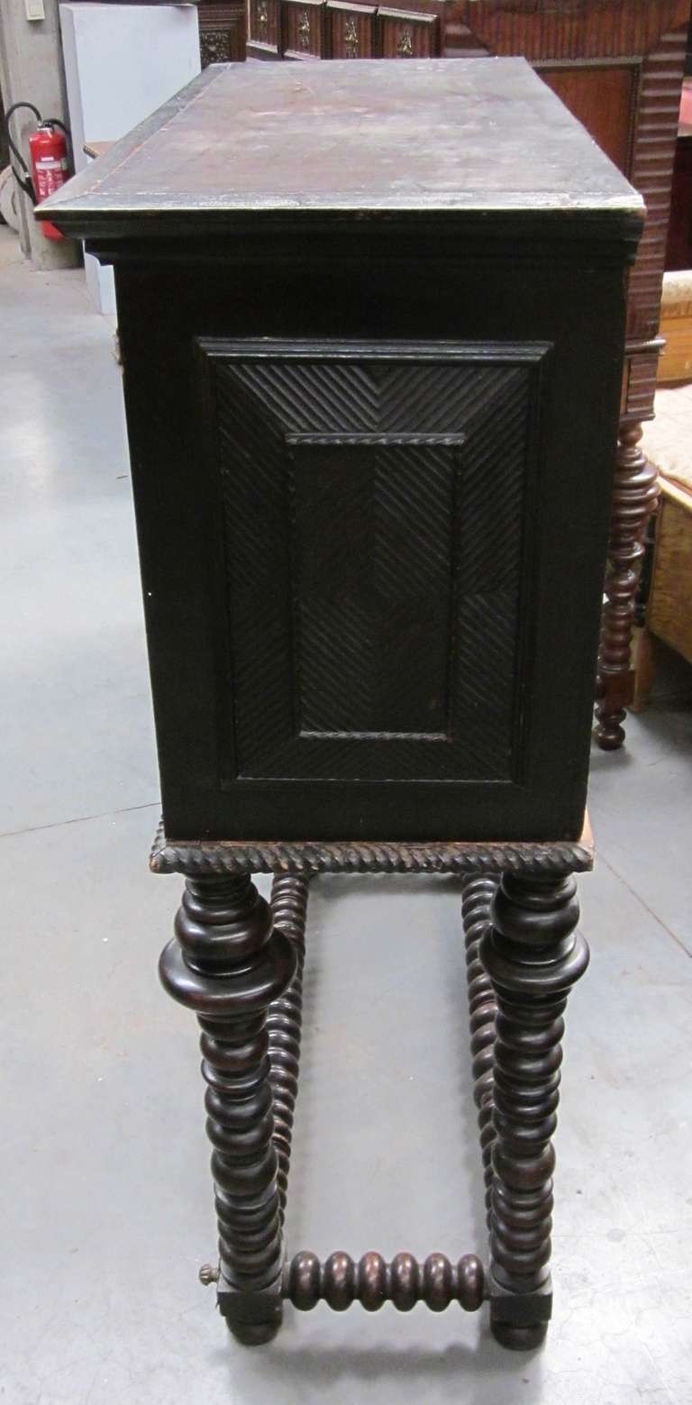 Very rare and unusual Portuguese multi drawer campaign cabinet.
Brass hardware.
Geometric design on front of drawers and on raised side panels.
Spool legs.