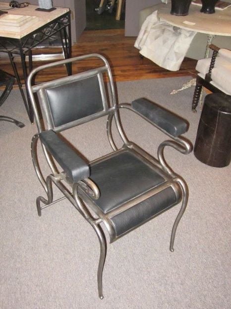 Rare one of a kind all over iron chair originally used in a dental office.

The chair reclines to different back heights.