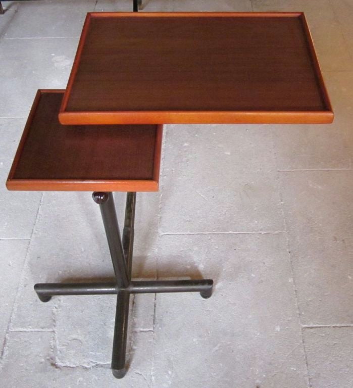 Mid-Century multifunctional table by Swiss designer Cannelle.
Great table that adjusts to different heights
Also larger surface can slant to different angles
Large surface can also fold over the smaller surface
Great for computers, bedside, side