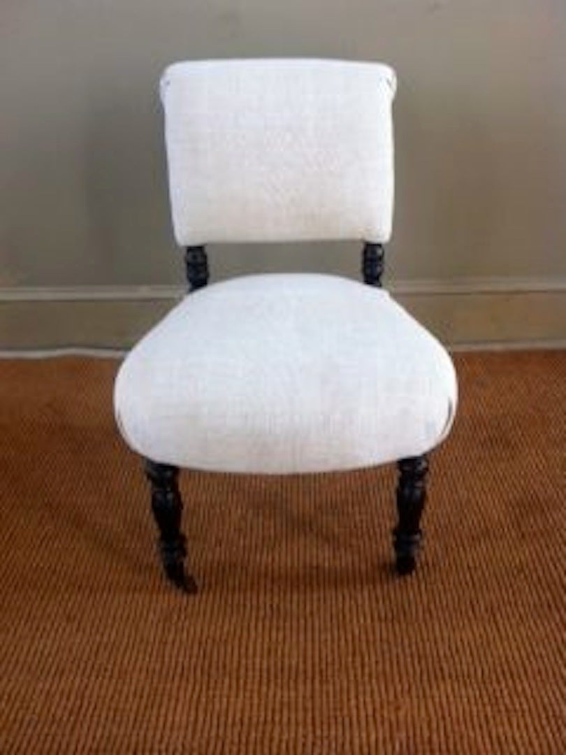 Classic 19th century French Napoleon III chair. Recently reupholstered in vintage Belgian linen. Note the turned ebony legs with casters.
Excellent condition.