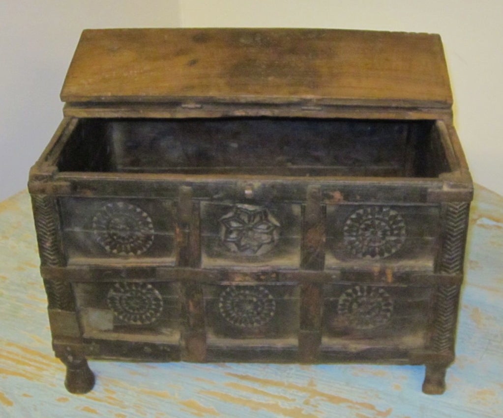 Decorative carved wooden box used for storage of important documents.