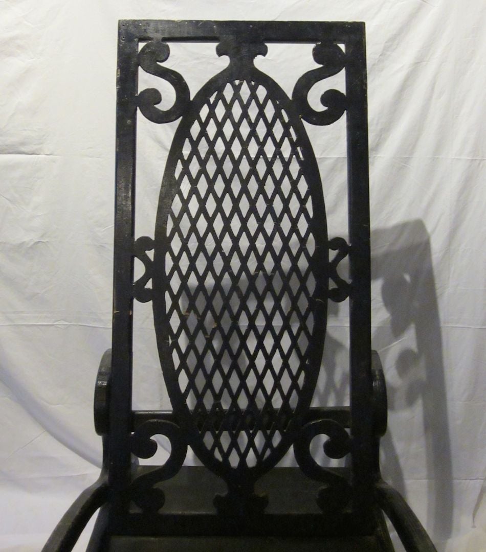 1920s French one of a kind oversized, over five feet tall, black painted wood rocker with a trellis design back. The arms and legs display beautiful curves.
This rocker is a considerable conversation piece.
A custom seat cushion can be added.