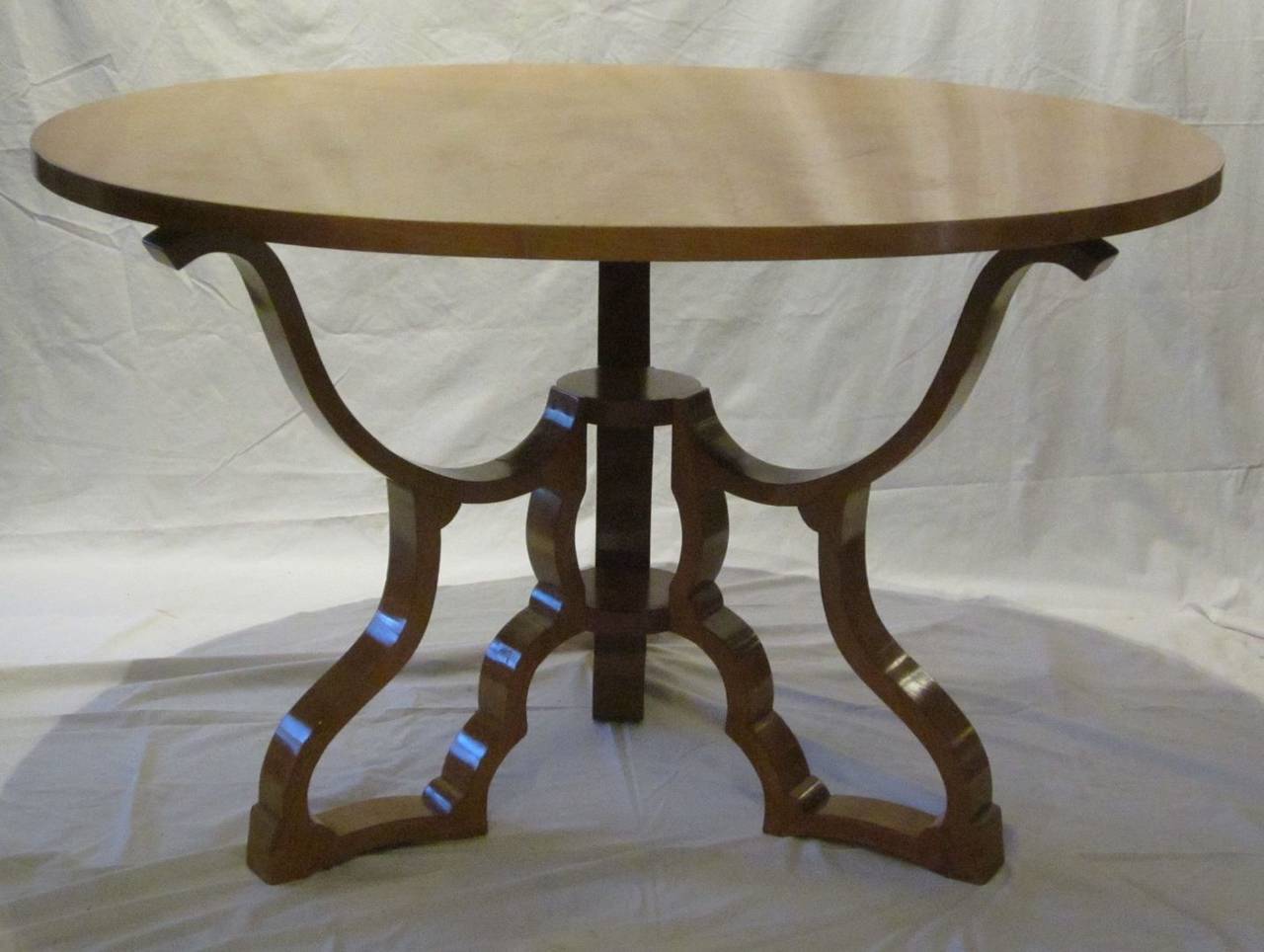 Polished maple dining table with cut-out decorative legs from Italy, 1940s.
The table can be used as either a dining table or centre hall table.
It is in excellent condition. Decorative lattice cut-out base details.