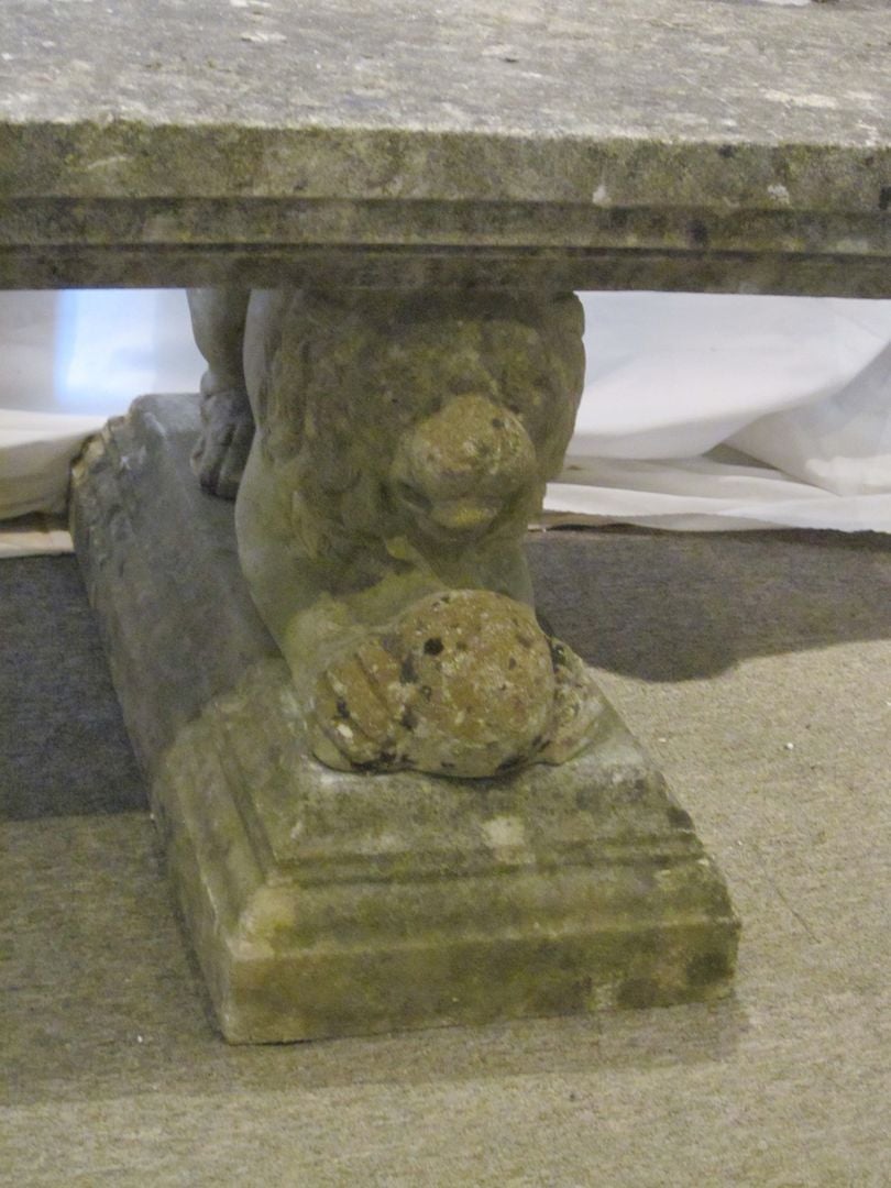 1940s circa, English composition stone garden bench with a pair of cast lion legs.
Great patina with spores and moss coloration.