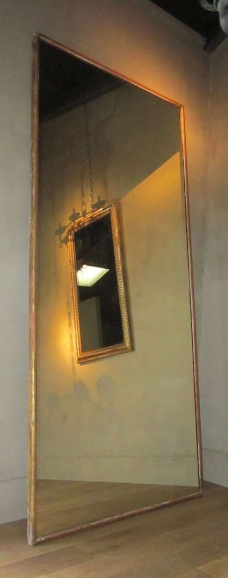 Thin gold gilt frame with slightly pitted mirror.
Grand oversized scale.