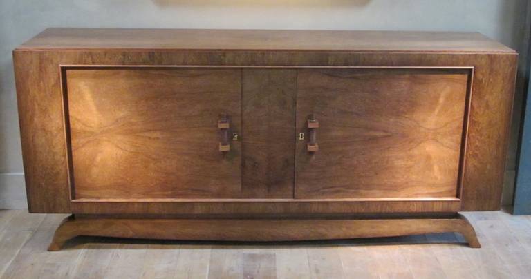 Rosewood two-door credenza with two drawers and four shelves.
