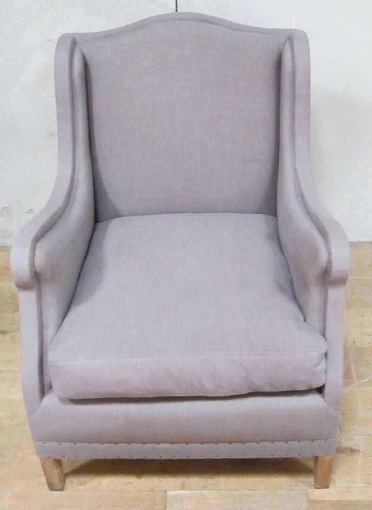 Spanish curved armchair with taupe brushed twill upholstery, down and feather cushion.
The entire frame is upholstered. Nailheads at the seat base.
Note the beautifully curved lines at the seat back and arms.
Recently reupholstered and very