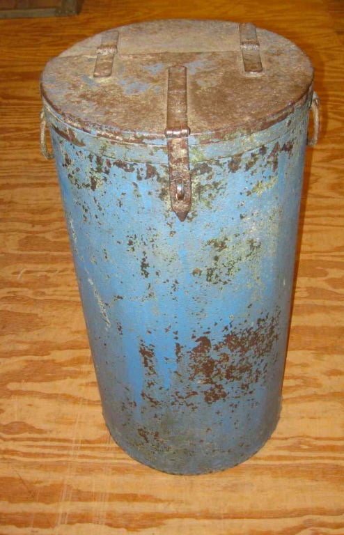 Metal storage bin with a wonderful faded blue patiina.<br />
Makes an excellent trash can, firewood storage bin, and even a side table.