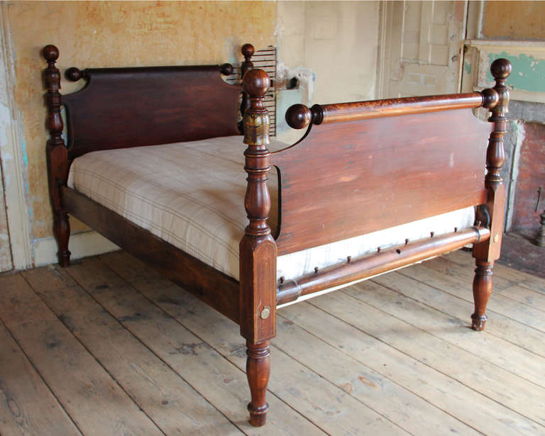 Cannonball bed with gilded stenciling and faux painted rosewood painted surface throughout. Bed assembles with bolts and has new side rails and slats to accommodate a full size mattress. Mattress and under mattress included. Mattress dimension: 54