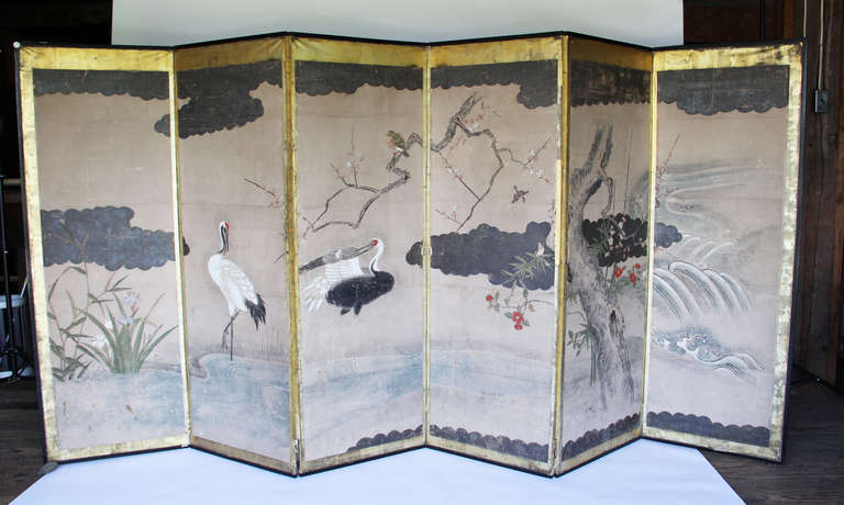 A Beautiful Screen. Hand Painted with Gilt Borders.
Mostly Cranes are Depicted with a Variety of Smaller Birds.
Each Bird shows a Subtlety of Design and Intricately Painted
Will Stand Easily Measuring about 7.5 feet
Panels Can Detach Creating a