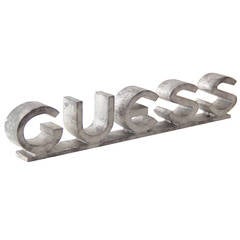 Great Bold Aluminum "GUESS" Sign