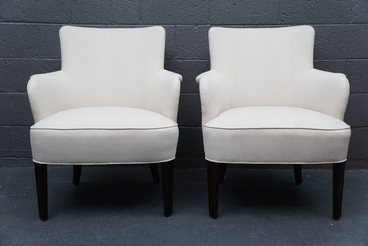 A pair of Mid-Century graphic and simple club chairs.