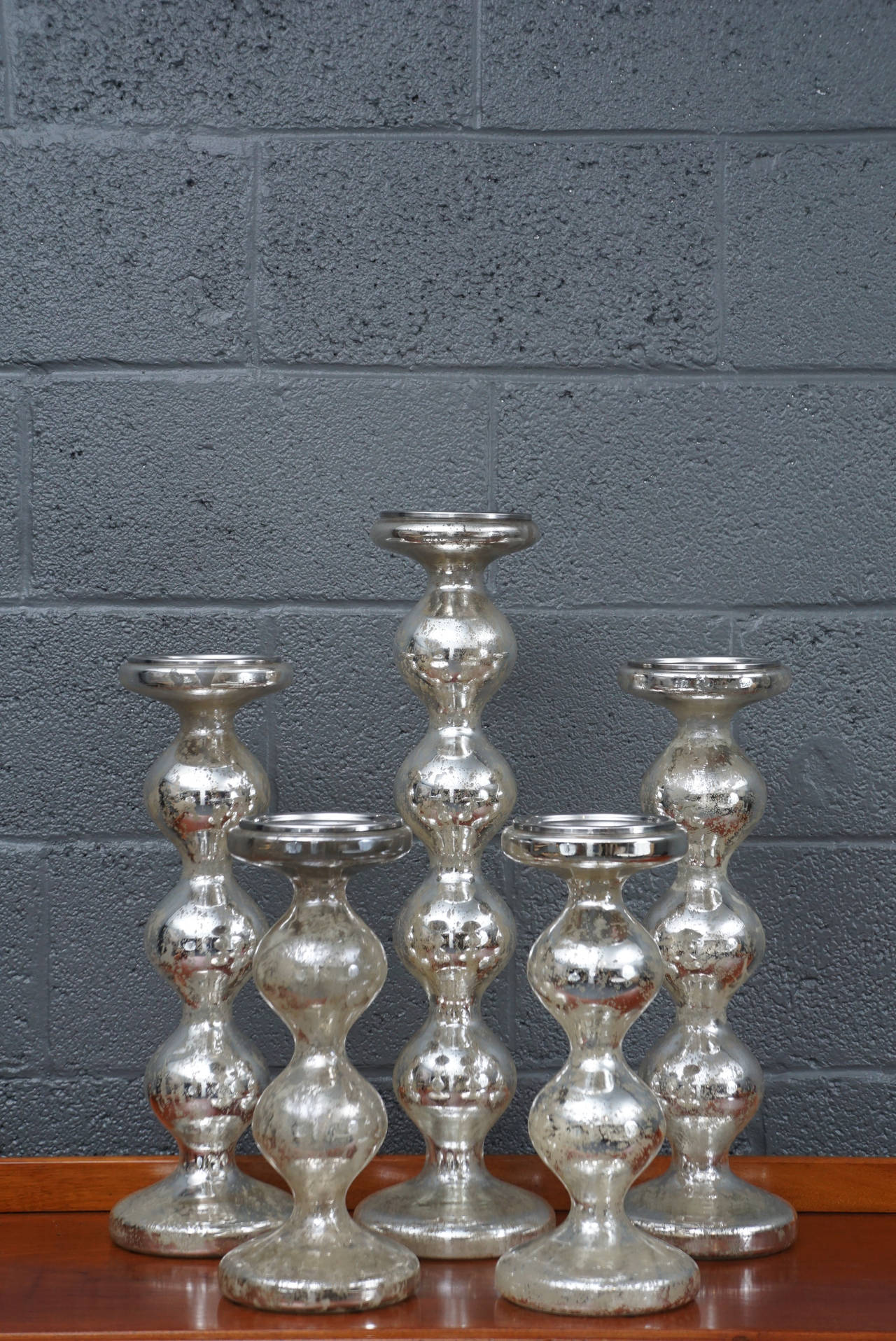 Five beautiful mercury glass candlesticks. A lovely collected arrangement.