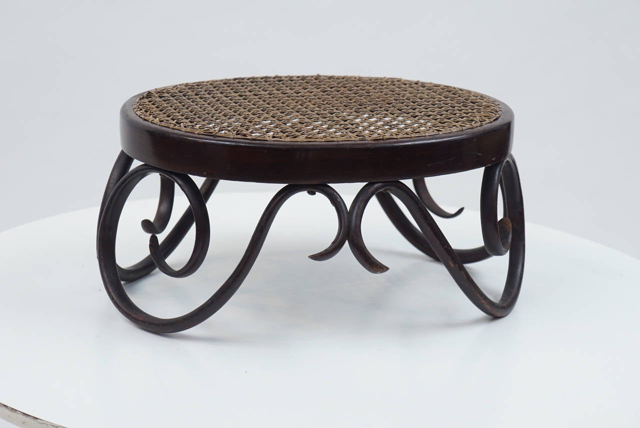 Created by the Thonet Company (founded by Michael Thonet in the late 19th century). This diminutive foot stool appears in the 1904 catalogue.
   