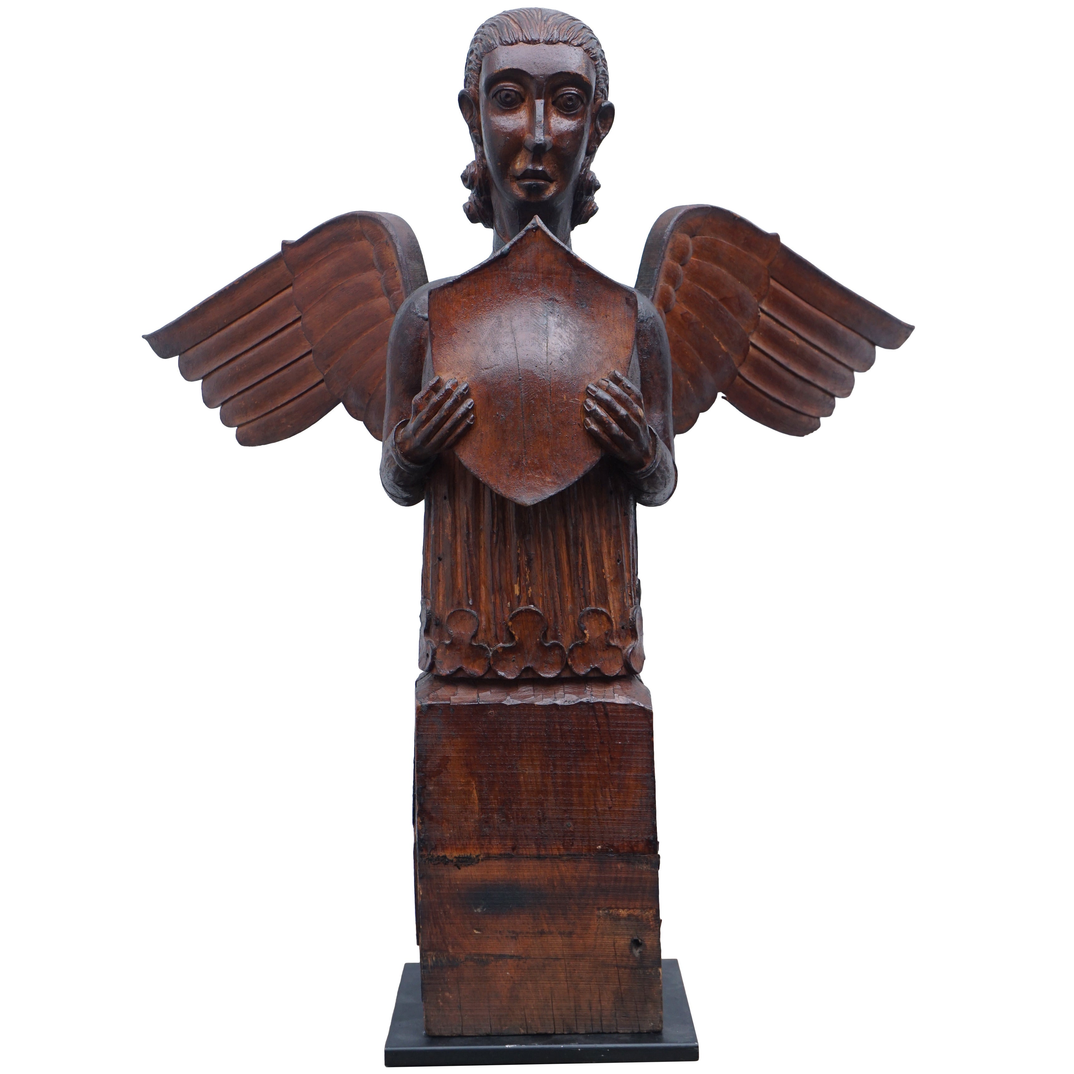 Large Carved Beatific Figure with Shield and Wings