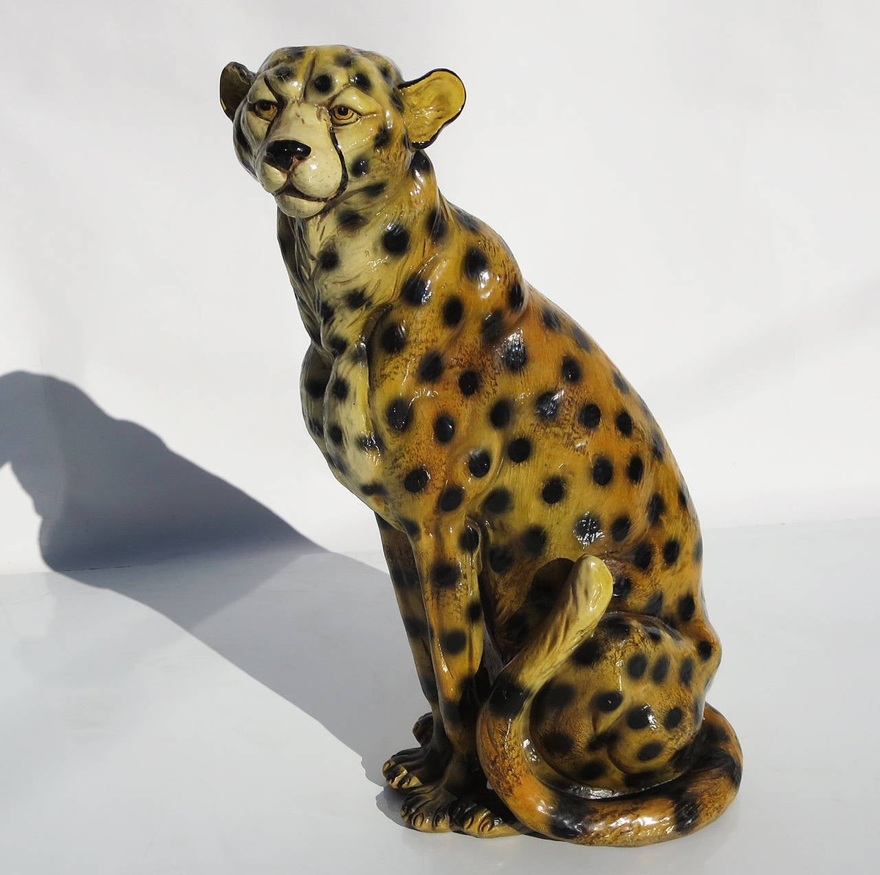 A lovely feline sculpture, hand decorated and glazed. The leopard is created in a hollowed resin, so it is manageable in weight, but not prone to cracking or damage. It can even be used outside, if desired. The jungle cat is in fine original