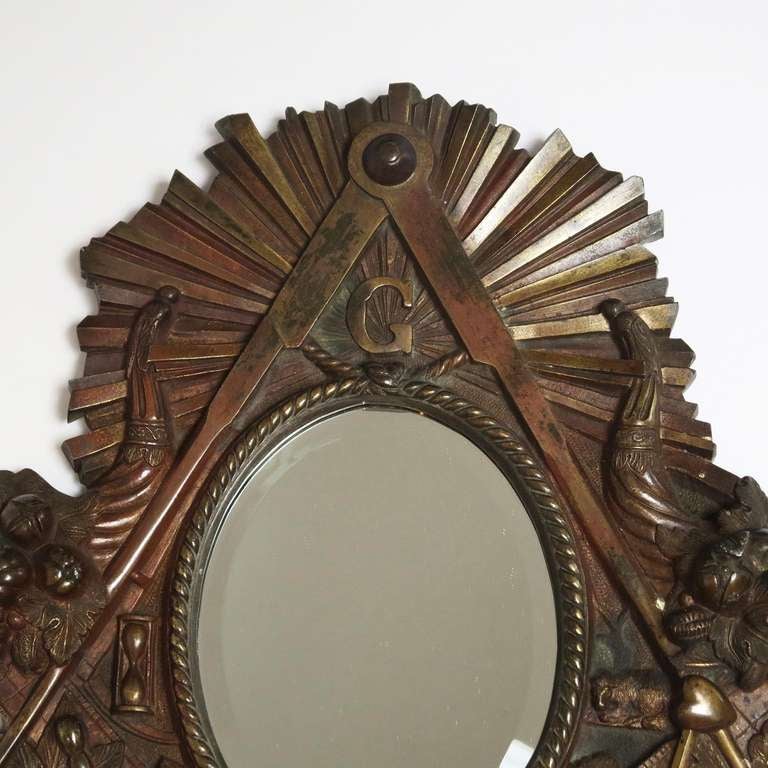 We have had and sold many Masonic and other fraternal items over the years, but none of this quality. The frame is solid cast bronze, with a lovely patina. All the symbols and elements of Masonic life are featured, to great effect. The mirror has