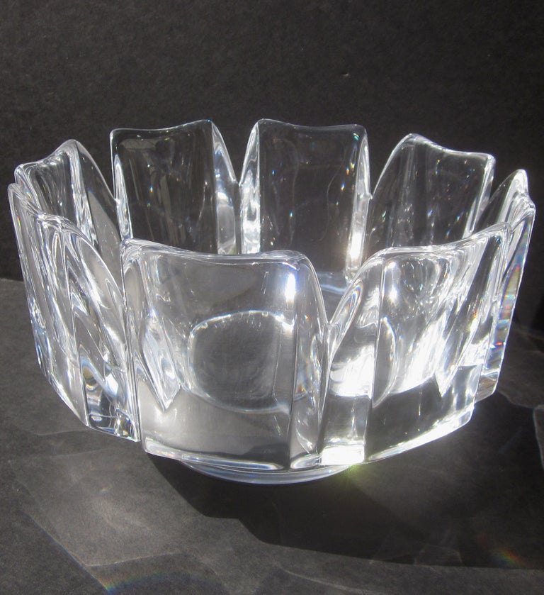 This lovely lead crystal bowl was created for Orrefors Glassworks of Sweden, and designed by Edvin Ohrstrom (1906-1994). Ohrstrom worked for Orrefors between 1936 and 1957, producing a variety of  fantastic forms in clear and colored crystal. Our