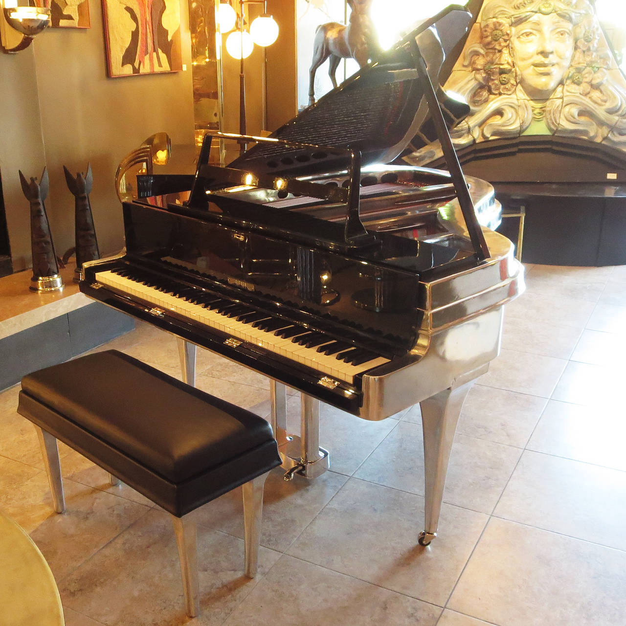 A fantastic instrument cased in an unbelievable cabinet design! The Rippen aluminum bodied piano was a revolutionary design when introduced in the mid 1950's. The tensile strength of the cast metal allowed the profile to be much thinner, while