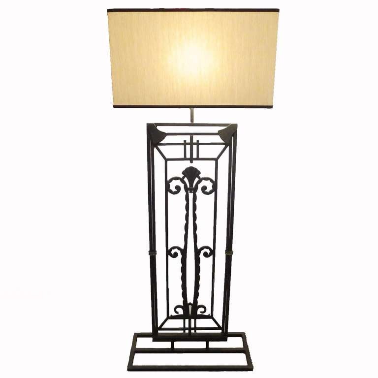 This lovely lamp was designed around an architectural form, similar to a window grill. It has been rewired in cloth cord, and features a new shade with a diffused top. It would be a strikingly interesting addition to any interior space. The slightly